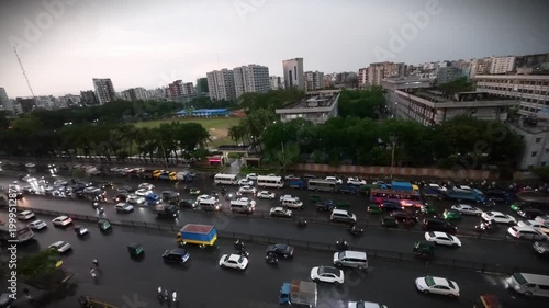 High Angle View of Dense Traffic Congestion on a Multi-Lane Urban Highway During a Rainy Twilight in a Bustling Asian Metropolis