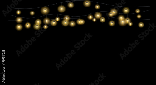 Warm-toned string lights forming a curved diagonal line on a black backdrop.