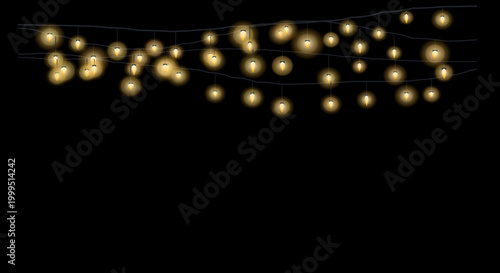 Scattered golden fairy lights create a whimsical, scattered pattern on a dark surface.