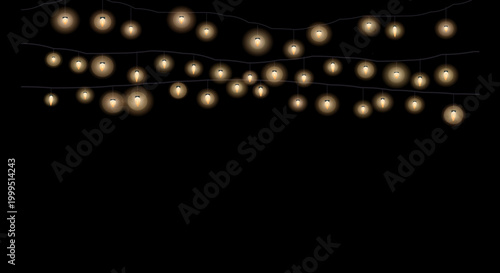 Golden fairy lights connected in a loose zigzag formation on a black backdrop.