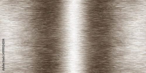 A close up of a diamond rests on a shiny brushed metal texture with a polished stainless steel silver surface and grey industrial aluminum material reflection