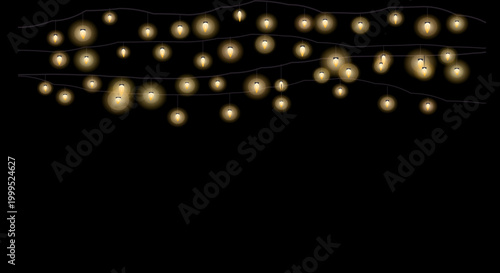 Golden string lights arranged in a loose, organic formation against a deep black background.
