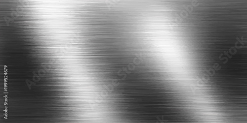 A polished silver brushed metal texture background featuring a shiny stainless steel plate surface with a grey metallic industrial material pattern on a reflective aluminum sheet backdrop
