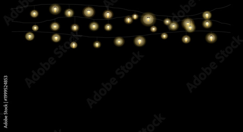 Golden fairy lights scattered randomly in a curved formation on a black backdrop.