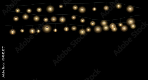 Warm string lights curved in a loose zigzag shape on a solid black backdrop.