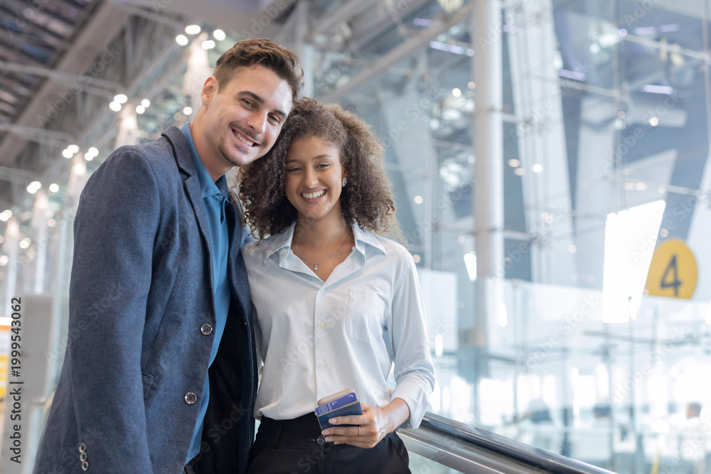 Obraz premium Couple shares a moment at an airport while waiting to board their flight together