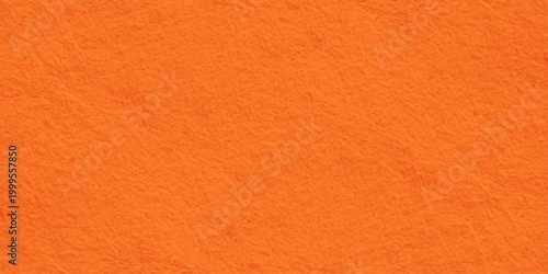 Vibrant orange handmade paper texture background with organic fiber grain detail. A blank orange paper and rough leather texture background, old material surface pattern with a red textile structure