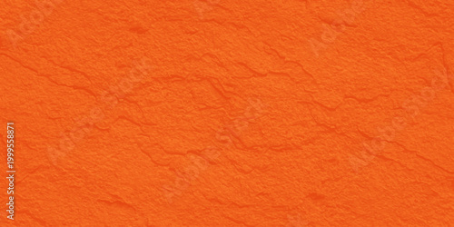 Vibrant orange handmade paper texture background with organic fiber grain detail. A blank orange paper and rough leather texture background, old material surface pattern with a red textile structure