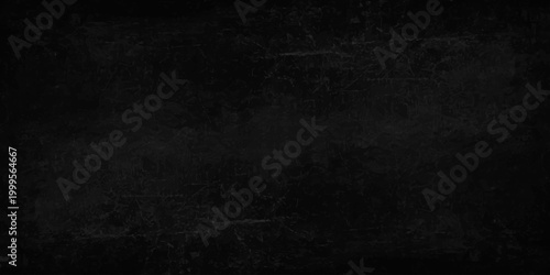 A dark grunge chalkboard backdrop with an empty aged paper texture, vintage grey concrete pattern. Dark charcoal grey slate texture background, moody industrial stone surface. weathered grit and grain