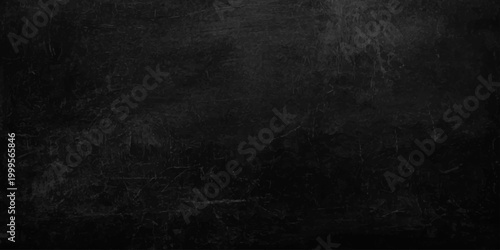 A dark grunge chalkboard backdrop with an empty aged paper texture, vintage grey concrete pattern. Dark charcoal grey slate texture background, moody industrial stone surface. weathered grit and grain