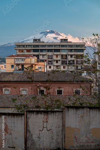 Mount Etna Rising Above Catania Rooftops