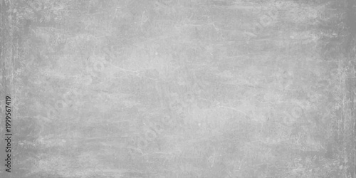 Aged black and white grunge metal texture featuring a dark gray concrete wall pattern. Light gray cement texture background with subtle weathered grit effects for industrial and modern graphic design