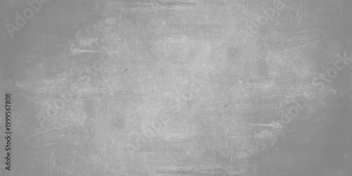 Aged black and white grunge metal texture featuring a dark gray concrete wall pattern. Light gray cement texture background with subtle weathered grit effects for industrial and modern graphic design