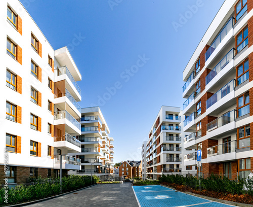 Beautiful new block house in the blooming garden. Housing development in Europe