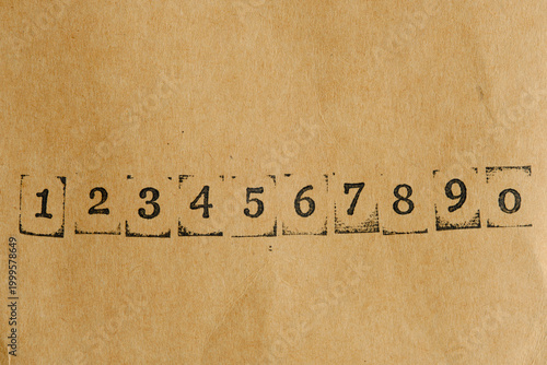 Horizontal sequence numbers from 1 to 0 on retro paper background.