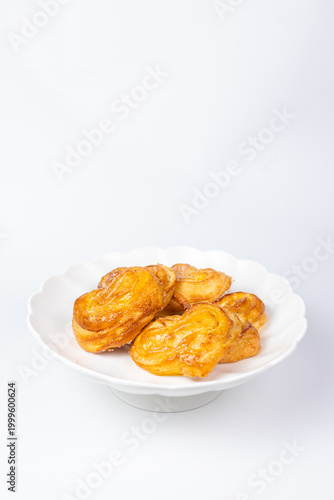 Sweet elephant ear cookies on an isolated white background.