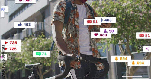 Holding road bike, cyclist wearing Hawaiian shirt with pack checking phone on sidewalk, with icons
