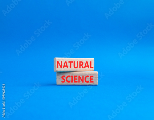 Natural Science symbol. Concept word Natural Science on wooden blocks. Beautiful blue background. Educational and Natural Science concept. Copy space