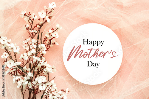 Happy Mother's Day. Top view of almond blossoms and round blank with the text Happy Mother's Day