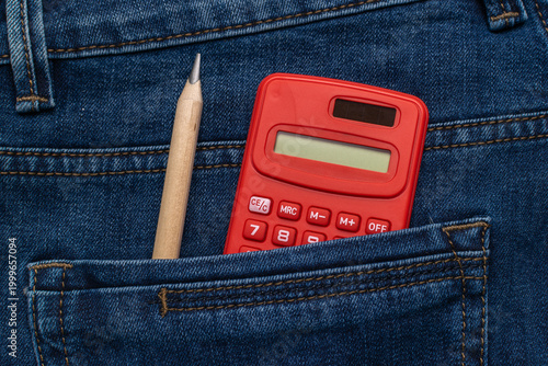 Photos Red Calculator and Pencil in Denim Pocket - Back to School Concept with Casual S