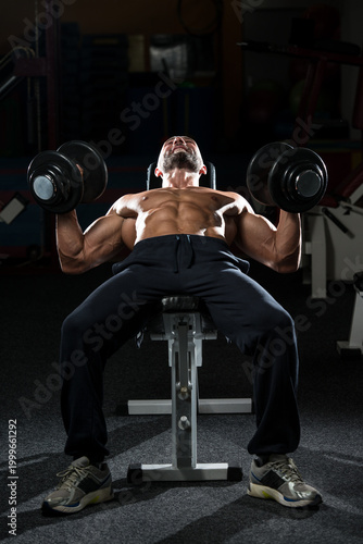 Mature Man Doing Dumbbell Incline Bench Press Workout