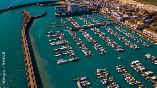 Fotografie Aerial view of curved stone breakwater protecting luxury boats in Brighton Marin