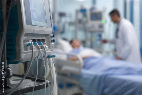 Close-up of ICU medical equipment in sharp focus with blurred doctor–patient interaction in background, cinematic hospital scene highlighting life support technology, critical care and clinical precis