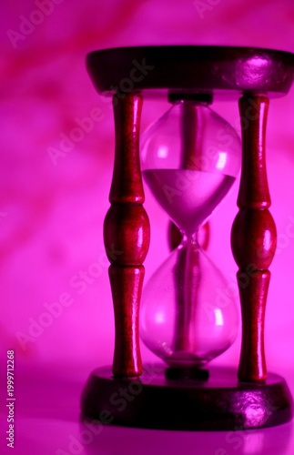 Hourglass as symbol of passing time concept photo vertical orientation art 