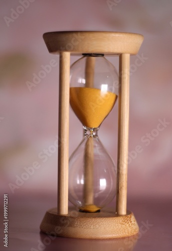 Hourglass as symbol of passing time concept photo vertical orientation art 
