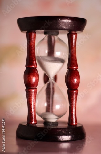 Hourglass as symbol of passing time concept photo vertical orientation art 