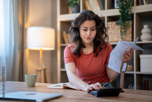 Photography Woman calculating finances, managing bills and budget