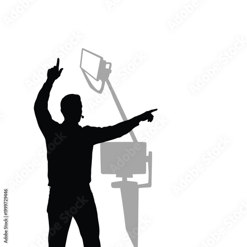 Speaker's silhouette actively pointing and communicating with a microphone headset.