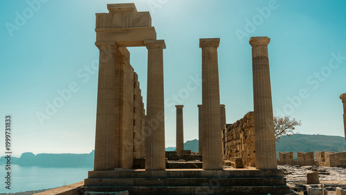 Картината върху платно Acropolis of Lindos on a hilltop in Rhodes, Greece, showing ancient ruins under clear sky with no people