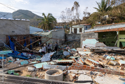 Photography Residents survey the extensive damage to their homes and community after a devastating storm in Nhon Hai, Quy Nhon, Binh Dinh, Vietnam