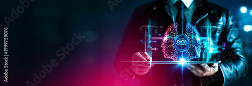 Modern business professional using futuristic data science technology with digital holographic interface and analytics visualization