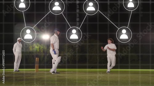 Bowler running and bowling batsman watching fielder lunging under expanding binary net for wicket