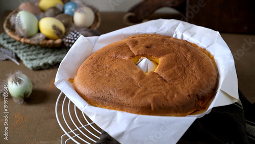 Traditional Portuguese Pao de Lo Sponge Cake in Parchment Paper with Easter Eggs