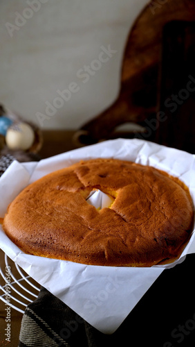 Freshly Baked Golden Sponge Cake in Parchment Paper