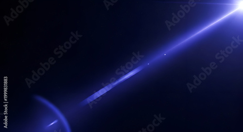 Bright blue light beam in darkness.