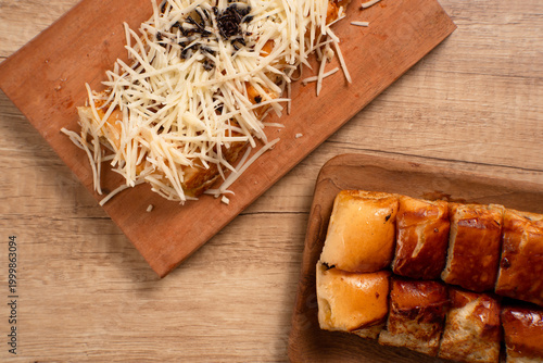 Roti Bakar Keju, Sandwich Bread Toast with Shredded Cheese. Popular Street Food from West Java. Perfect for recipe, article, catalogue, or any commercial purposes. with copy space.