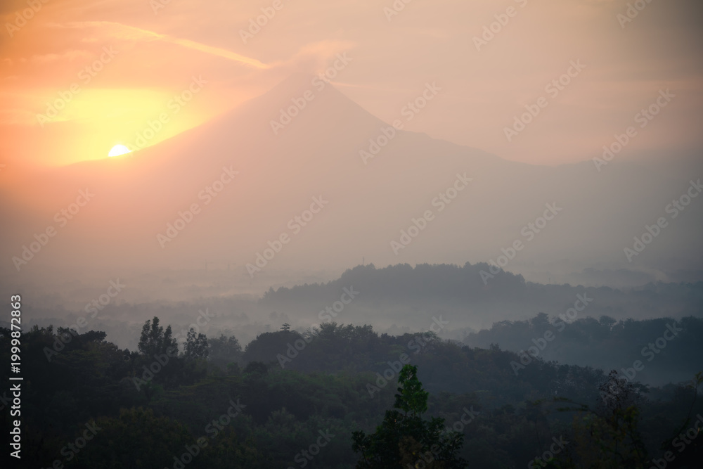 Fototapeta premium View Mount Merapi and Borobudur from Puthuk Setumbu, Java, Indonesia