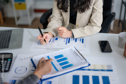 Business team analyzing financial data and growth reports
