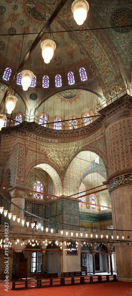 Fototapeta premium Interior of Blue Mosque Sultan Ahmed with stained glass windows and decorated dome, Istanbul, Turkey