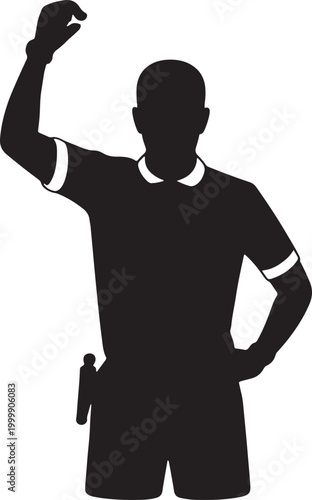 Silhouette of a soccer referee signaling a foul with an arm raised on a professional field matc