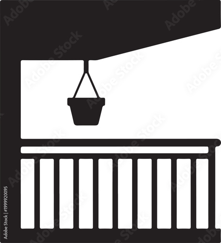 Black and white of a balcony with a hanging flower pot, featuring a railing and an overhead roof structure
