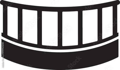 Black and white of a curved balcony railing with vertical posts and a solid base