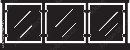 Black and white of a three-panel glass balustrade railing with metal posts