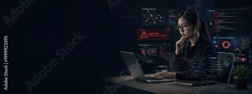 Professional female analyst working with data on laptop in dark modern office environment. Banner and Copy space for Text