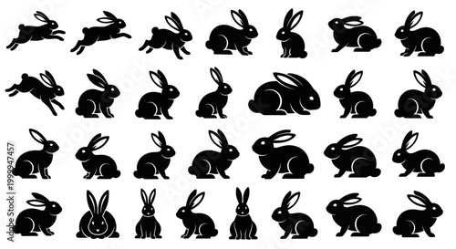 Set of black rabbit silhouettes in various poses and positions.