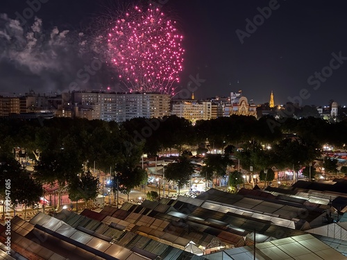 Obraz na plátně fireworks over the city Fireworks illuminating the sky over the Feria de Abril fairground in Seville, Spain